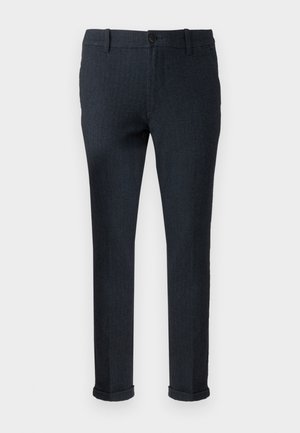 Dark blue tailored pants made of textured fabric, featuring a button closure and rolled cuffs for a fitted appearance.