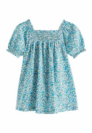 Blå og hvid blomstret bluse med firkantet udskæring og puffede korte ærmer, med rynket detalje over brystet.