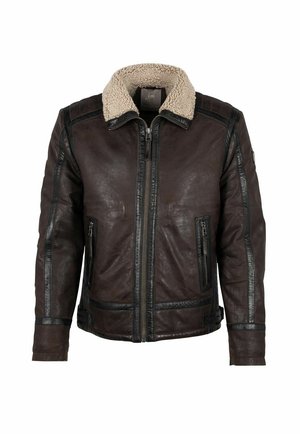 Bruine leren jas met een nepshearling kraag, ritssluiting aan de voorkant, zijzakken en zwarte accentstrepen langs de naden. Zachte, textuurrijke afwerking.