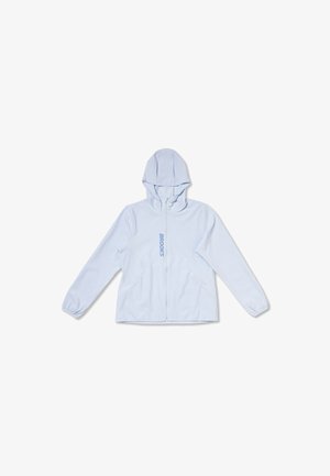 Gaiši zila rāvējslēdzēja jaka ar kapuci, elastīgām aprocēm un vertikāli iespiestu "BROOKS" logotipu priekšējā rāvējslēdzēja daļā.