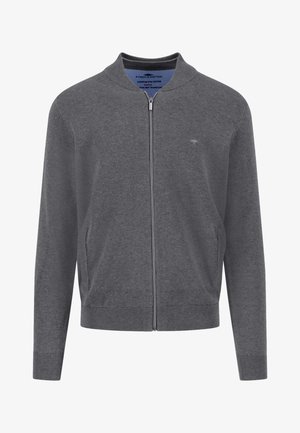 Szürke cipzáras kardigán pamutból, amely könnyű textúrával, bordázott mandzsettákkal és szegéllyel, valamint két oldalzsebbel rendelkezik. Egyszerű, minimalista dizájn.