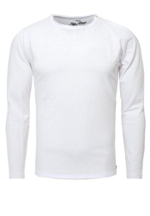 Camiseta blanca de manga larga hecha de algodón. Cuello redondo y puños acanalados. Diseño sencillo, sin patrones visibles ni acentos de hardware.