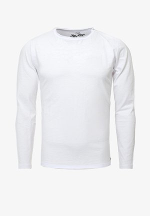 Biała, długosleeve'owa koszulka z bawełny. Okrągły dekolt i ściągacze przy rękawach. Prosty design, bez widocznych wzorów lub akcentów metalowych.