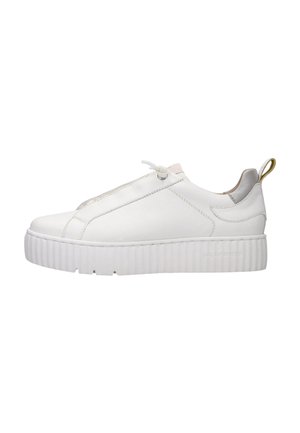 White low-top sneaker with thick ribbed sole, slip-on design, elastic lace, and yellow pull tab on heel.
