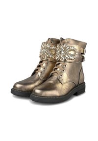 Bottines en bronze métallique à lacets, semelle noire, et large sangle décorative ornée de pierres précieuses claires et dorées.