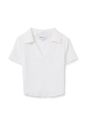 Camisa blanca de manga corta con cuello en V y diseño con cuello. Hecha de un tejido texturizado, presenta un corte ligeramente relajado y un dobladillo recto.