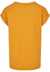 Lyhythihainen t-paita kirkkaankeltaista puuvillaa, jossa on pyöreä kaula-aukko ja käännetyt hihansuut. Paita on sileäpintainen ja löysä malli.