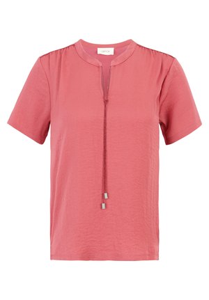 Short-sleeved, light pink top with a round neckline and a decorative drawstring tie at the front. Soft, textured fabric with subtle sheen.