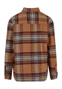 Bruin geruit overhemd met button-down kraag, met grote blokpatronen in rood, zwart en beige. Gemaakt van zachte, textuurrijke stof.