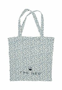 Vit tygkasse med blå blommönster, två långa remmar och texten "THE NEW" broderad i nederkant på mitten.