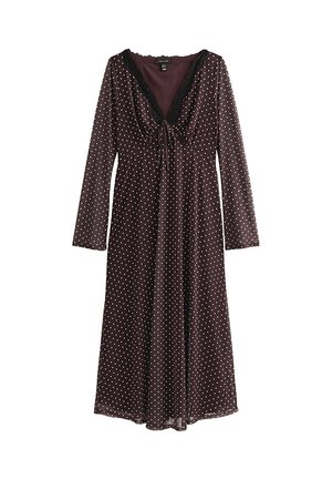 Donkerpaarse midi-jurk met lange mouwen en witte polkadots, diepe V-hals met zwarte kanten rand en een klein voorstrikdetail.