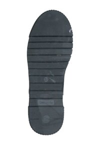 Semelle de chaussure en caoutchouc noir avec motif texturé et rainuré, et bout arrondi. La taille "37" est visible, avec un marquage de marque près du talon.
