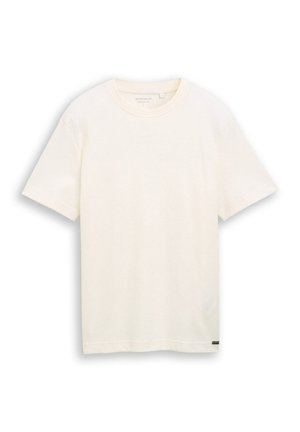 Kurzärmliges, elfenbeinfarbenes Baumwoll-T-Shirt mit rundem Ausschnitt, minimaler Struktur und kleinem schwarzen Markenzeichen am Saum auf unifarbenem Hintergrund.