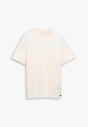 Kurzärmliges, elfenbeinfarbenes Baumwoll-T-Shirt mit rundem Ausschnitt, minimaler Struktur und kleinem schwarzen Markenzeichen am Saum auf unifarbenem Hintergrund.