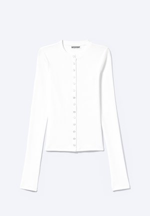 Λευκή εφαρμοστή ζακέτα με μακρύ μανίκι, στρογγυλή λαιμόκοψη και κούμπωμα με πατιλέτα στο μπροστινό μέρος, με ετικέτα "Weekday".