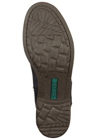 Czarna podeszwa buta z teksturowanym wzorem gumowym; posiada zielone logo i odcisk rozmiaru 37; wzmocnione krawędzie dla większej trwałości.