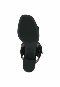 Scarpa in camoscio nero con suola in gomma testurizzata, apertura sul retro e cinturino regolabile, numero 37, dotata di una fodera interna liscia e un branding discreto.