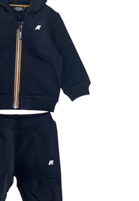 Felpa con cappuccio e pantaloni neri per bambini, con zip frontale, polsini a costine e piccolo logo bianco sul petto e sulla coscia, taglia 12 mesi.