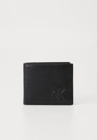 Portefeuille en cuir noir avec une finition texturée, design bi-fold et logo "ck" gaufré à l'avant. Style minimaliste sans embellissements supplémentaires.