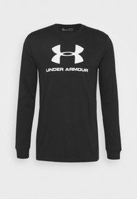 Svart långärmad t-shirt i bomull, med en stor vit Under Armour-logga över bröstet och rundad nacke.