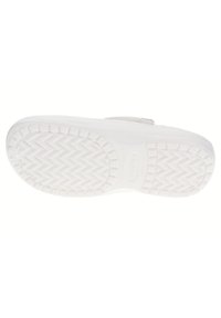 White rubber shoe sole with a textured zigzag pattern, featuring a subtle logo and smooth edges. Lightweight and designed for comfort.