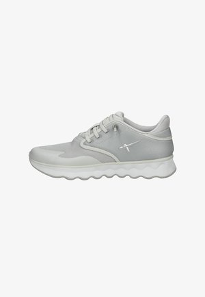 Light grey athletic shoes with a mesh upper, rounded sole, and cushioned design. Features laces and a small logo on the side.