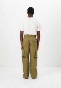 Pal Sporting Goods COLLECTIVE PANTS UNISEX - Cargobukse - khaki