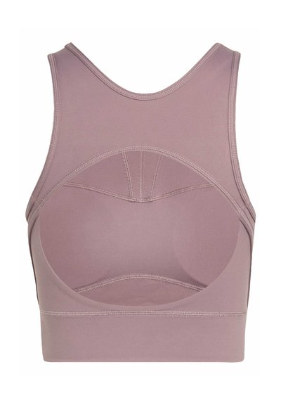 Back view of mauve sports bra with racerback design and cutout detail below shoulder blades.