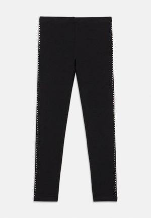 Black leggings with a smooth texture, featuring a side embellishment of silver studs along the outer seams. Elastic waistband.