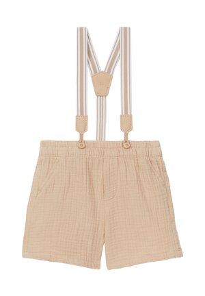 Beżowe szorty z fakturowanej tkaniny z elastycznym stanem oraz przypiętymi beżowo-białymi paskami na szelki zapinanymi na guziki.
