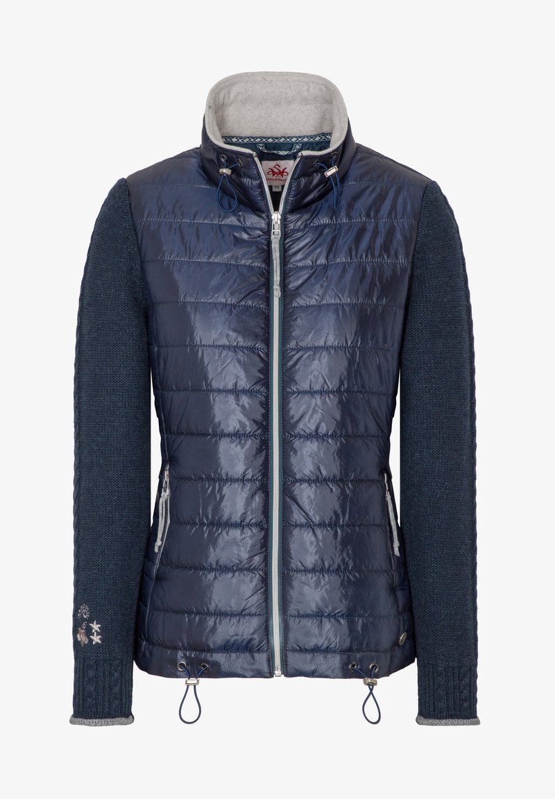 Veste matelassée marine avec un devant en tissu matelassé, des manches en tricot texturé, un col intérieur gris, une fermeture éclair et une broderie décorative au niveau du poignet.