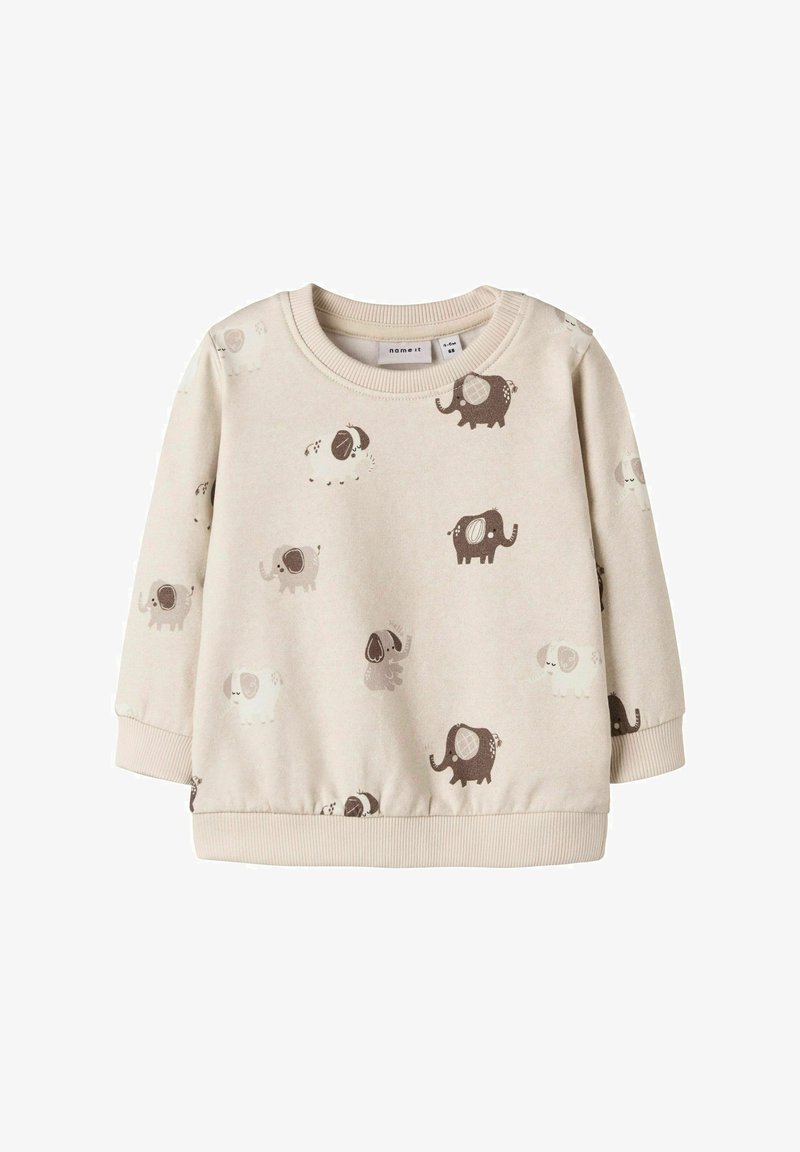 Felpa beige chiaro con una morbida texture, decorata con divertenti pattern di elefanti e cani in grigio e marrone. Polsini e orlo a costine.