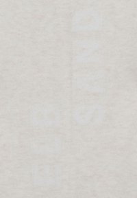 Light beige fabric with a soft texture, featuring faint white lettering vertically along the center. Minimalist design, no visible hardware.