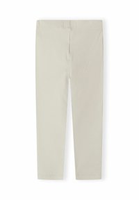 Beiga ribbade stickade leggings med en figurnära längd till anklarna och elastisk midja, visade liggande på vit bakgrund.