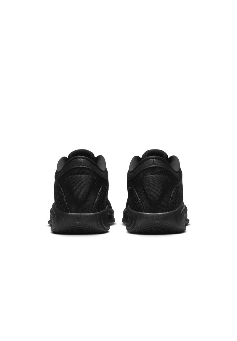 Zapatillas deportivas negras con un upper suave, talón texturizado y suela acolchonada, diseñadas para la comodidad y el rendimiento.