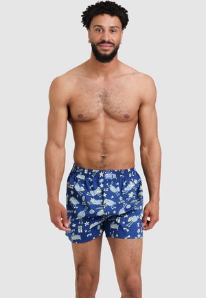 Blaue gemusterte Boxershorts aus Baumwolle, mit Schafen, Sternen und schlafbezogenen Motiven, einem elastischen Bund und einer lockeren Passform.