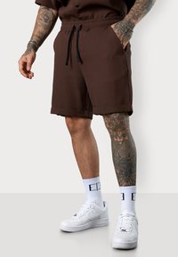 ESTEEM PLEATED - Tracksuit bottoms - coffee