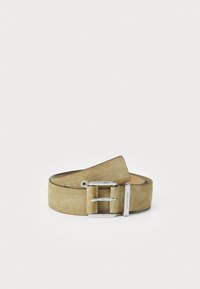 Suede belt in light olive green with a silver-tone metal buckle and a logo accent. Features a smooth inner lining and distinctive cut.