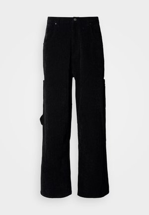 Black corduroy wide-leg pants featuring a textured fabric, two front pockets, and a side cargo pocket. Button closure at the waistband.