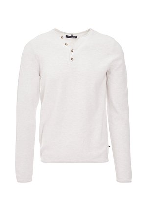 Camicia a maniche lunghe color beige chiaro in tessuto morbido, con scollatura henley e tre bottoni marroni, e orlo dritto in vita.