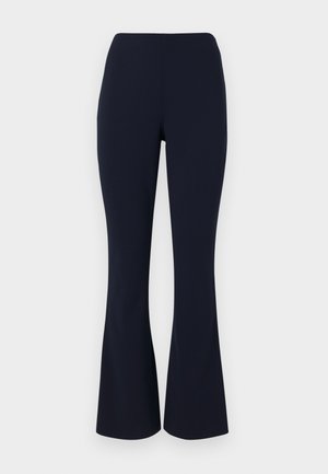 Granatowe spodnie w stylu dzwonów, wykonane z gładkiego materiału, z wysokim stanem i subtelnym streczem dla komfortu. Bez widocznych elementów metalowych ani wzorów.