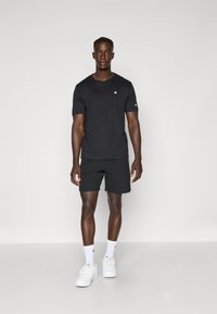 Champion C-TECH SHORTS - Kurze Sporthose - black