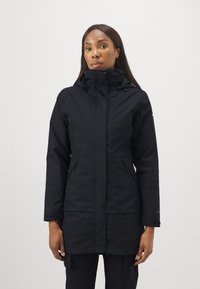 Svart lang parka-jakke med høy krage, justerbar hette med snøring, frontlommer med glidelås og sidelommer. Glatt, vannavvisende stoff.