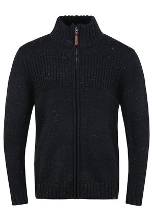 Marineblauer Strickpullover mit hohem Kragen und durchgehendem Reißverschluss, der strukturierte Muster und mehrfarbige Einsprenkelungen aufweist. Rippbündchen und Saum.