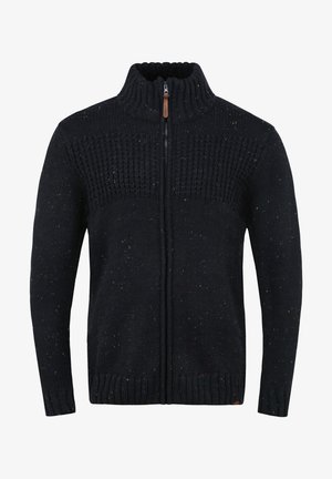 Marineblauwe gebreide sweater met een hoge kraag en een volledige rits, voorzien van gestructureerde patronen en veelkleurige spikkels. Geribbelde manchetten en zoom.