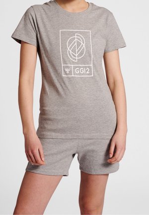 Person wearing a grey short-sleeve T-shirt and matching shorts with a white geometric logo and "GGI2" text on the shirt front.
