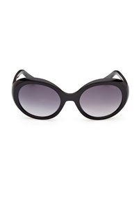 Lunettes de soleil ovales noires surdimensionnées avec des verres dégradés gris foncé et des montures épaisses, présentées sur un fond blanc.