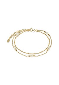 Delicate gouden dubbele kettingarmband met kleine gouden kralen en witte parels, ronde sluiting en verstelbare verlengkettinkje.