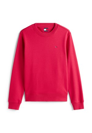 Red sweatshirt made from soft fabric, featuring a crew neck, ribbed cuffs, and a small logo patch in contrasting colors on the chest.