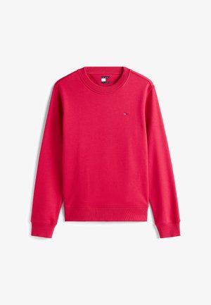 Sweatshirt rouge en tissu doux, avec un col rond, des poignets côtelés et un petit logo en couleurs contrastées sur la poitrine.